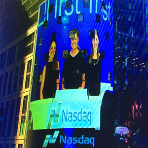 On a skyscraper in New York ringing the bell at the Nasdaq