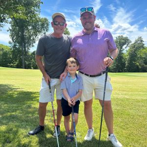 David with father and son at golf course