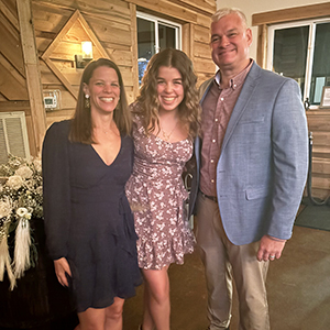 With my husband, Mike, and daughter, Sydney at a friend’s wedding